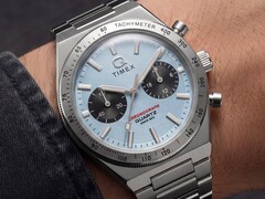 Close-up of the Timex Q Timex Continental Chronograph TW2Y92400 worn on a wrist, featuring an ice-blue radial CD-style dial, black sub-dials, silver tachymeter bezel, and integrated stainless-steel bracelet.