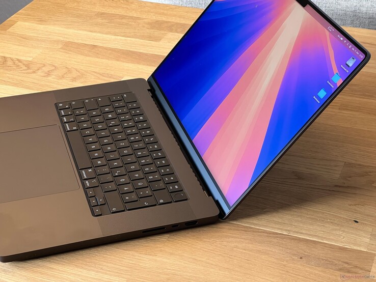 The image shows a photo of the space black M5 Pro MacBook Pro in its 16-inch shape.