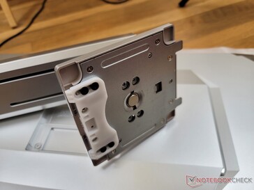 Arm attaches to the back of the monitor with plastic and metal hinges