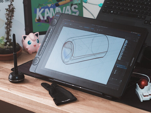 Huion Kamvas 16 Gen 3 on desk with stylus drawing glove and keyboard