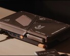 A custom-built compact game console featuring a mini PC, exposed cooling vents, USB ports and orange power buttons on a desk.
