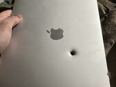 An Apple M1 MacBook Air reportedly stops a shell fragment (Image source: lanevychs on X)