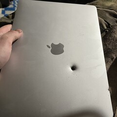 An Apple M1 MacBook Air reportedly stops a shell fragment (Image source: lanevychs on X)