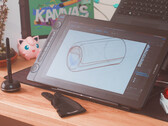 Huion Kamvas 16 Gen 3 on desk with stylus drawing glove and keyboard
