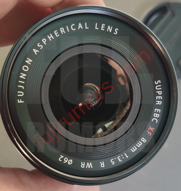 The lettering ont he front of the Fujinon XF8mm f/3.5 R WR lens indicate that it will have weather seling, a 62mm threaded filter thread, and the Super EBC coating. (Image source: Fuji Rumors)