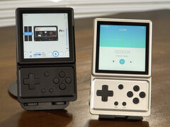 The Anbernic RG Rotate in its Aurora Silver and Polar Black finishes, from left to right.
