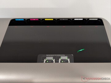 Labelled ink cartridge slots.