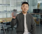 Carl Pei, CEO of Nothing, holding up a blurred Nothing Phone (3). (Image source: Google)