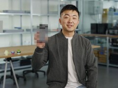 Carl Pei, CEO of Nothing, holding up a blurred Nothing Phone (3). (Image source: Google)