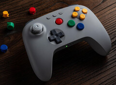 The colors of the buttons on the grey 8BitDo 64 Bluetooth Controller match those of the original Nintendo 64 controller