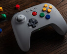 The colors of the buttons on the grey 8BitDo 64 Bluetooth Controller match those of the original Nintendo 64 controller