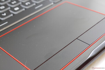 Red-trimmed touchpad feels smooth, but responsiveness is unreliable