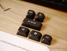 Extra keycaps for OS mode switching and to replace coloured accent keys. 