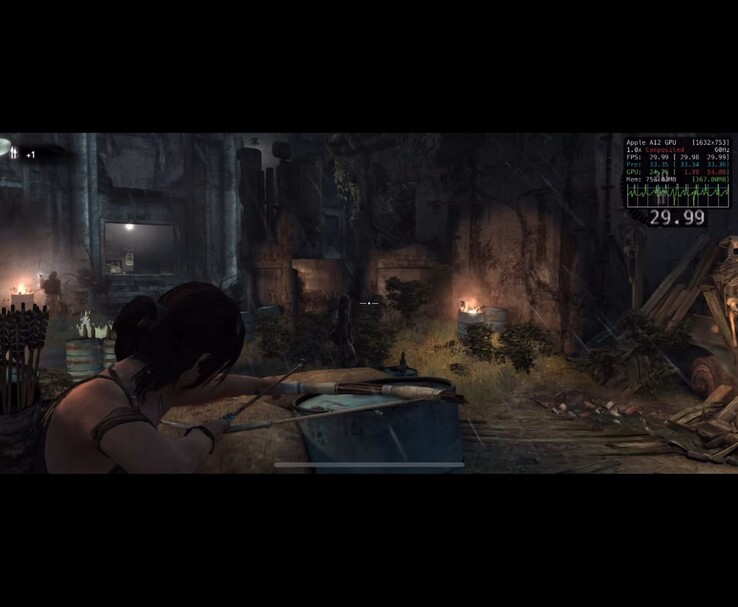 Tomb Raider gameplay running on iPhone XS showing Lara Croft aiming a bow inside ruins with performance overlay displaying FPS and hardware metrics