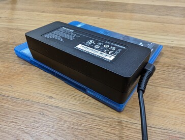 Small-medium (13 x 5.2 x 3.3 cm) 100 W AC adapter