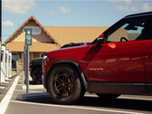 Rivian's R1S electric SUV is now capable of delivering 400 miles of range on a single charge, but it means drivers will have to spend more time charging. (Image source: Rivian)