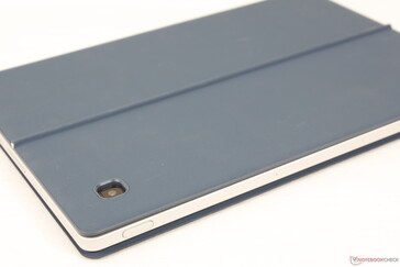 Kickstand plate attaches magnetically to the back. The plate is firmer than the keyboard base