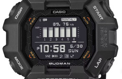 Casio G-Shock Mudman GDG-B100 watch with red and white digital display against a rugged mountain landscape.