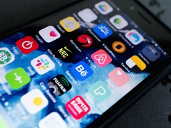 Close-up of a smartphone screen with many app icons