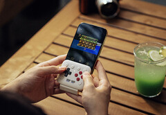 The 8BitDo FlipPad plugs into the USB-C port of your smartphone.