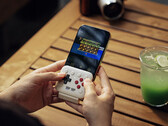 The 8BitDo FlipPad plugs into the USB-C port of your smartphone.