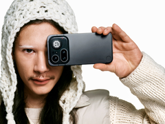 A model holding the new Nothing Phone (4a) Pro.
