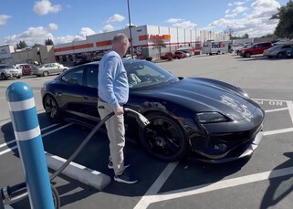 Charging the Porsche Taycan 2025 prototype before testing (Image Source: Out Of Spec Reviews)