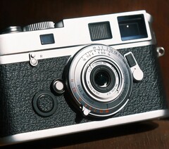The Brightin Star 28 mm f/2.8 full-frame lens is barely larger than a camera body cap.