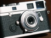 The Brightin Star 28 mm f/2.8 full-frame lens is barely larger than a camera body cap.