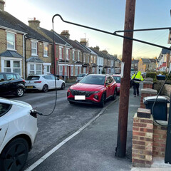 An electric car charging on the street in the UK (Image source: SGS Energy)