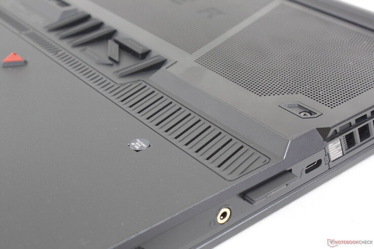 Fully inserted SD card protrudes slightly from the edge. The slot is not spring-loaded