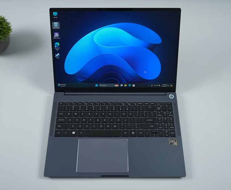 AIM Max+ laptop featuring a full-size keyboard, large trackpad, and AMD Ryzen AI Max+ branding, running Windows 11. (Image Source: ETA Prime on YouTube)