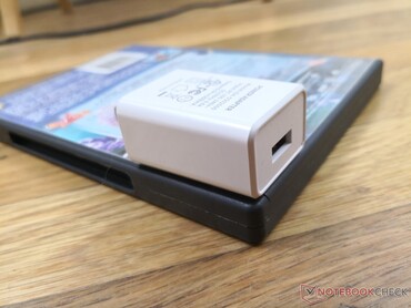 Small (~4.8 x 3.7 x 2.4 cm) 10 W USB-C AC adapter