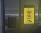 Pictured, the "We're sorry we upset you, Carol" advertisement on the Samsung smart refrigerator screen. (Image source: u/Shellnanigans via r/assholedesign)