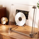 The Syitren RM1 CD player displays CDs in its transparent case.