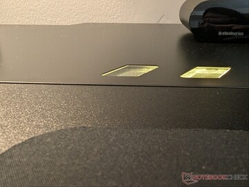 Slight bulge in the metal top sheet where the LED strip below bends.