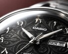 Close-up of the Casio MTP-E735AR’s black dial, featuring an intricate arabesque pattern, raised Eastern Arabic numerals, polished silver-tone hands, and a day-date display at 3 o’clock.