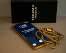 A picture of the Trump Phone T1 alongside the box and cable.