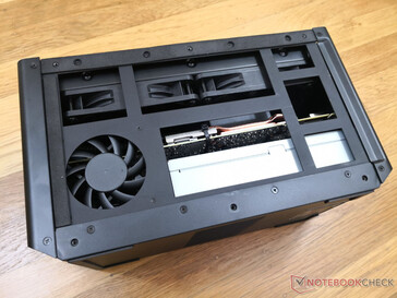 Removing the side panel exposes the ~65 mm aux fan, PSU, twin 12 cm fans, and the GPU