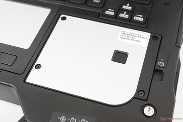 The right palm rest is secured by four Philips screws since it doubles as the fourth xPAK expansion slot