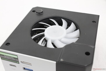 Removing the C-shaped metal cover reveals a fan on the top and a fan on the bottom