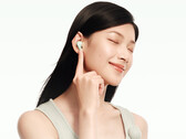 The Redmi Buds 8 costs around $33 in China. Pictured: a promo picture showing the earbuds being worn.