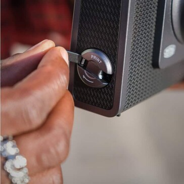 Turning the folding crank handle starts printing (Image source: Fujifilm)