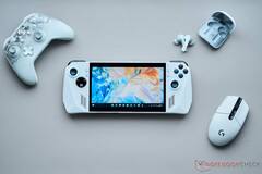 Asus ROG Ally windows gaming handheld on a desk with a mouse, controller, and earphones