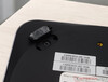 The screws are located under the rubber feet