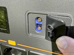 Starter assist and auxiliary battery ports under cover