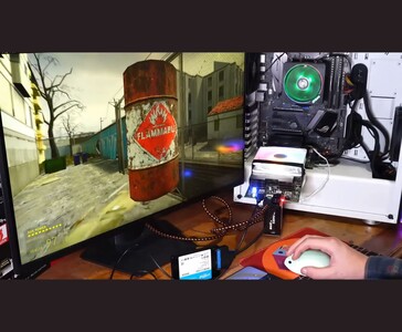 Half-Life 2 on a Linux setup powered by the AMD BC250 board connected to a monitor, mouse, keyboard, and external SSD (Image source: Budget-Builds Official via YouTube)