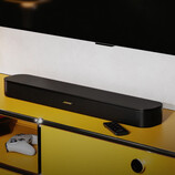 The TV Speaker 2nd Gen launches with a center tweeter. Pictured: the soundbar under a TV.