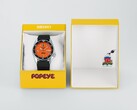 Seiko 5 Sports x Popeye HDB013 automatic watch with an orange dial resting beside its limited-edition yellow presentation box.
