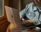 Person using a Microsoft Surface laptop by a window (Image source: Surface on Unsplash)